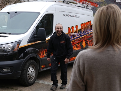 All Fuel technician greeting a customer in their driveway