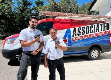 Associated Team in front of their van