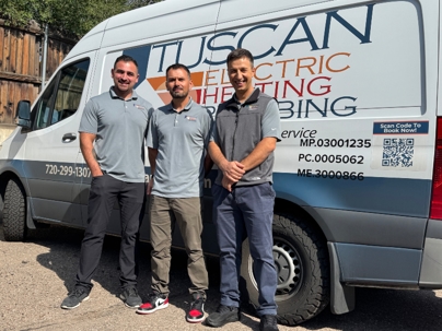 The Tuscan team standing in front of their van