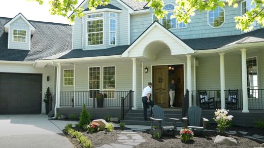 Front of home with SEER Brand Partner greeting customer